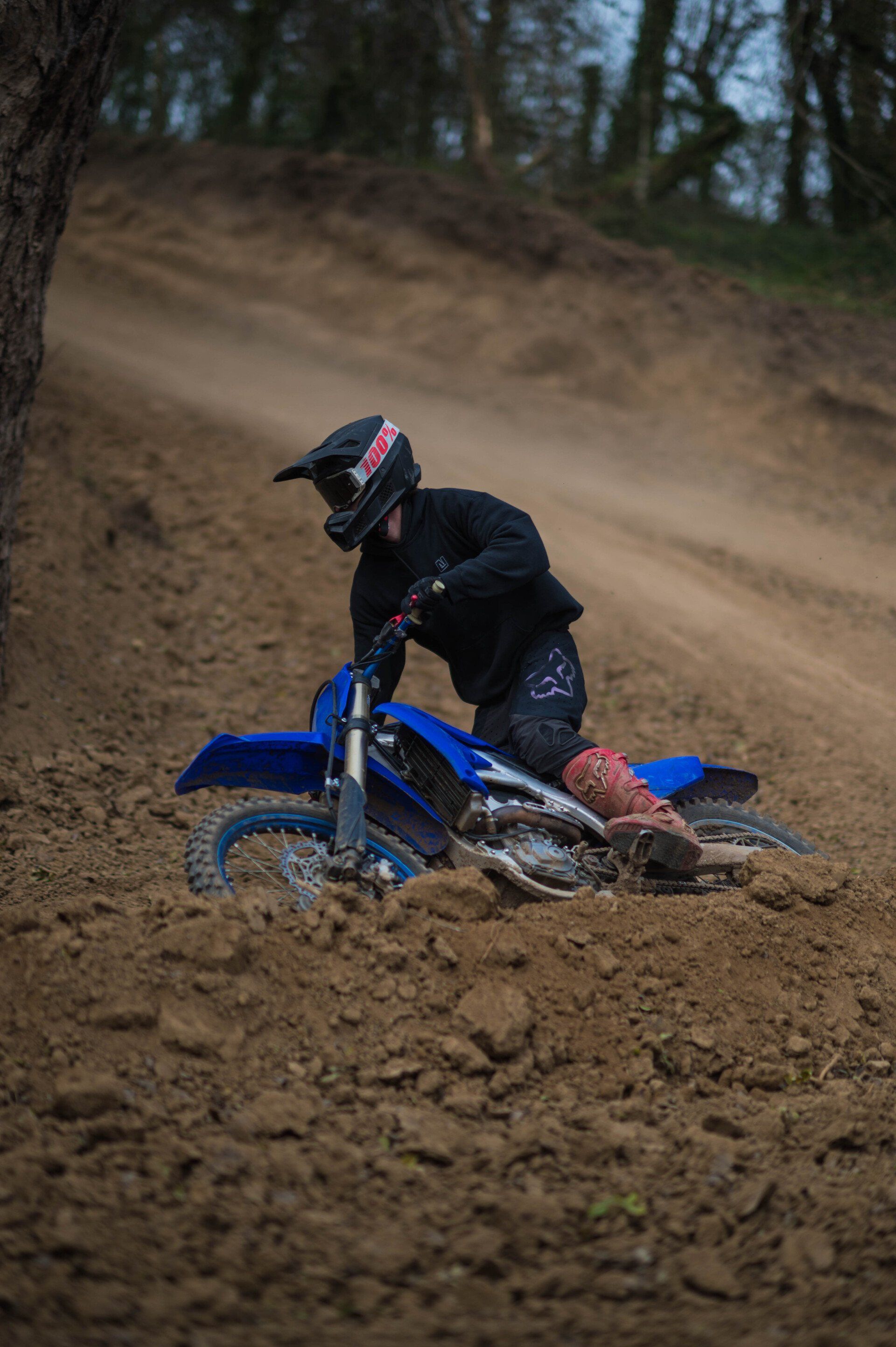Rider leaning into a turn at Creekside MX